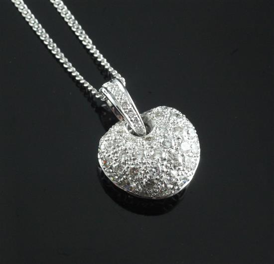 A modern 18ct white gold and pave set diamond heart shaped pendant, on an 18ct white gold chain, pendant 12mm.